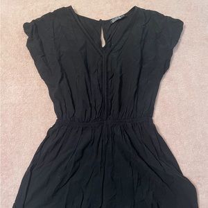 Cute black romper with cinched waist & detailing around neckline & down stomach